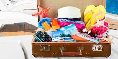 Suitcase Stuffed with Vacation Gear