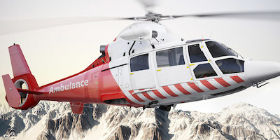 Ambulance Helocopter Taking Off in Mountains