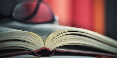 Book with Glasses resting on it