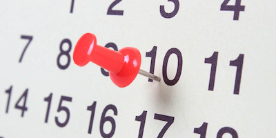 A Pushpin on the 10th Day of a Month on a Calendar