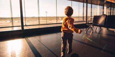 Little Boy Playing in Airport