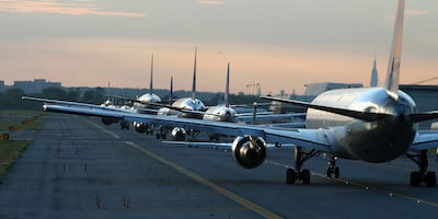 Long Line of Planes Waiting to Take Off on Tarmac