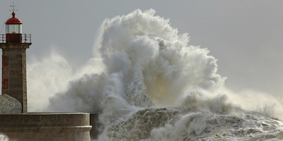 Large Wave About to Hit a Lighthouse